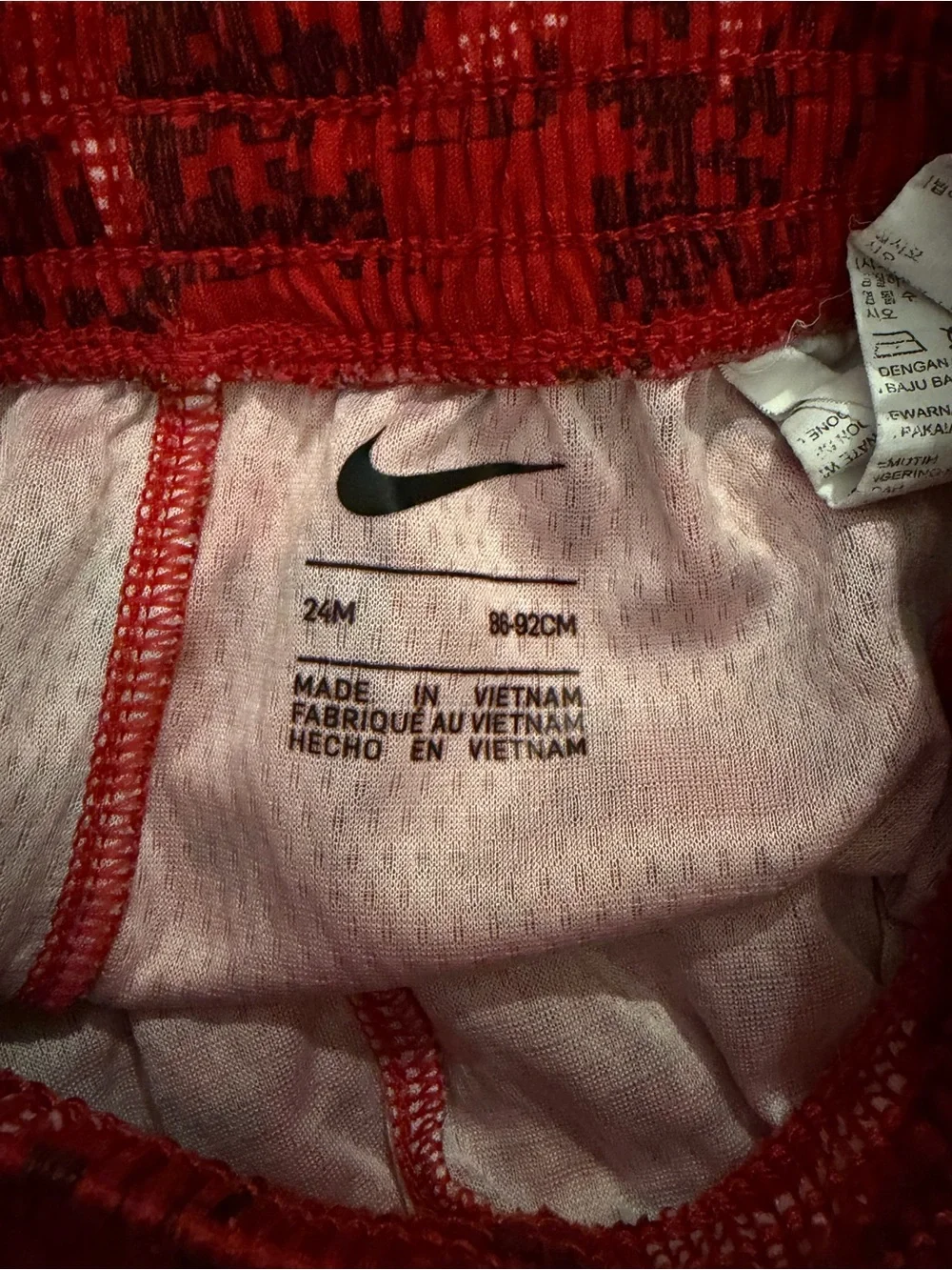 Nike Gray Tee with Black Logo and Red Patterned Shorts